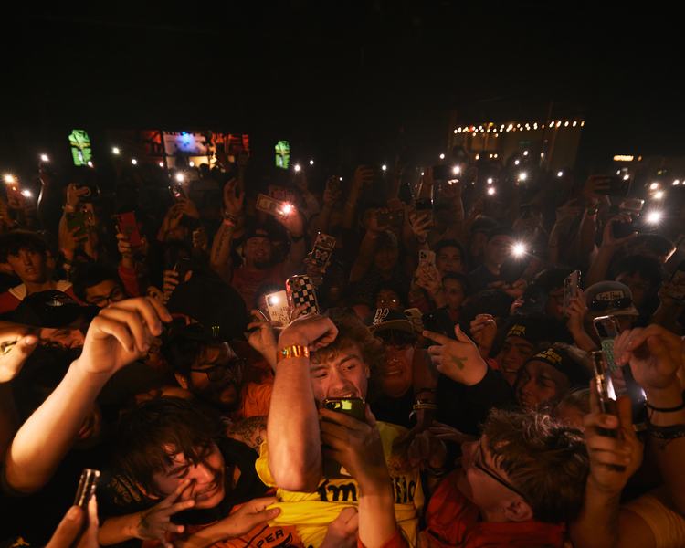 Noah Neumann with fans at an outdoor event